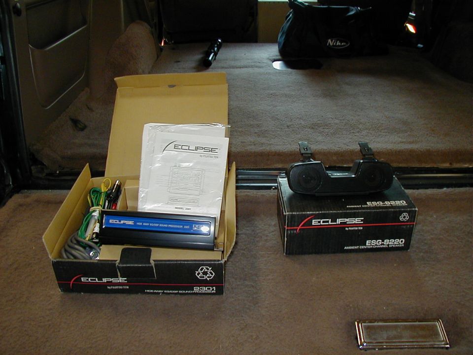 Car interior with Eclipse stereo and speakers on boxes