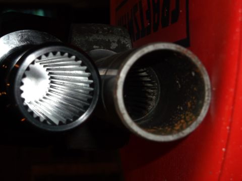 1999 Mercury Grand Marquis - A close-up view shows the splined interior of two metal components, likely part of a drivetrain or suspension system. One component is silv…