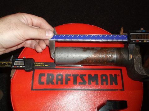 1999 Mercury Grand Marquis - A digital caliper measures the diameter of a metal cylinder, which is resting on a red Craftsman tool or stand. The caliper reads 6.000 inc…