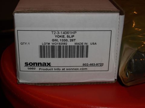 1999 Mercury Grand Marquis - A white Sonax box with a label showing part number T2-3-14061HP, YOKE, SLIP, GM, 1330, 28T. The label also indicates QTY: 1, LOT# WO192582,…