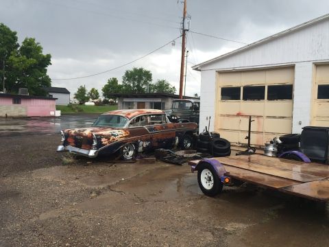 1968 Ford Mustang - Outdoor photo of a project car and trailer, not a technical document.