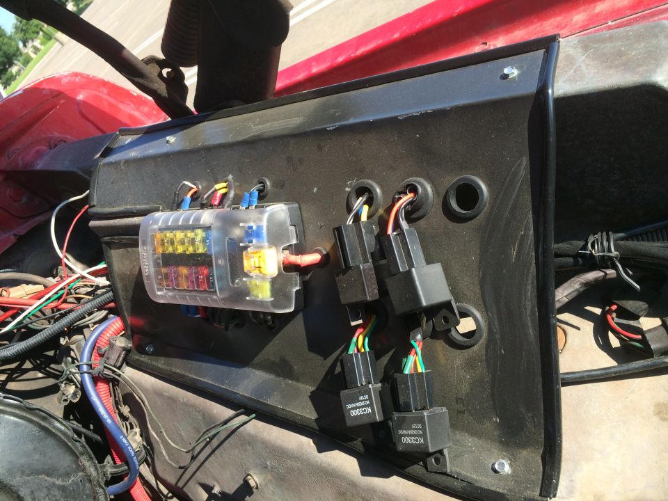 Build a relay panel from a sheet of steel from Lowes. Painted it with left over engine paint from my transfer case rebuild.