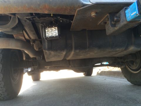 1979 Ford Bronco - Installed some cheaper flood lights from Amazon in the frame rails next to the fuel tank. Ran wires through plastic sheathing up to the new…