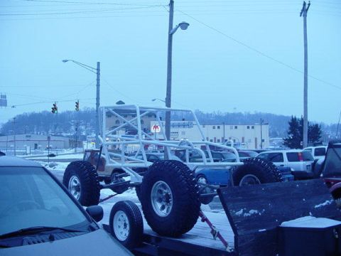 1992 Ford Bronco - Custom off-road buggy being transported on a trailer during winter.