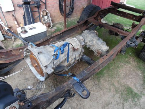 1993 Ford Bronco - The frame is nearly empty, but it still has to roll & steer so the trans/t-case can be removed.