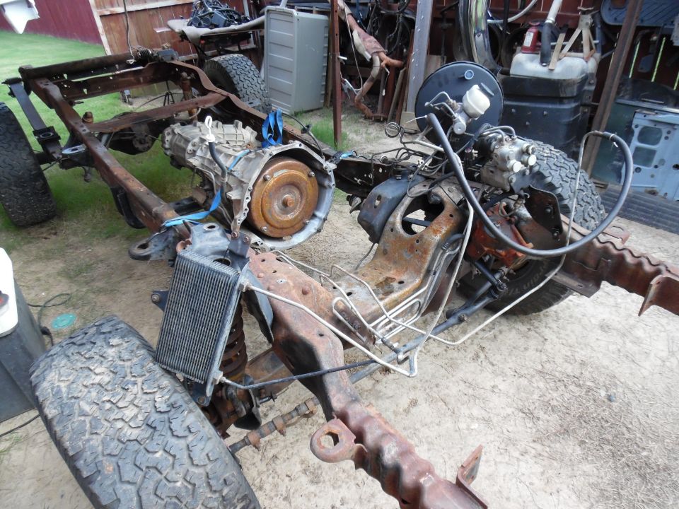 The frame is nearly empty, but it still has to roll & steer so the trans/t-case can be removed.