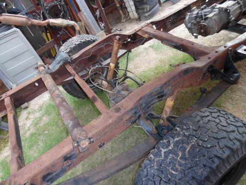 1993 Ford Bronco - The frame is nearly empty, but it still has to roll & steer so the trans/t-case can be removed.
