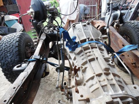 1993 Ford Bronco - The frame is nearly empty, but it still has to roll & steer so the trans/t-case can be removed.