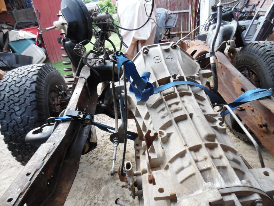The frame is nearly empty, but it still has to roll & steer so the trans/t-case can be removed.