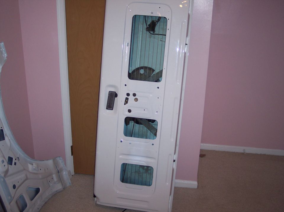 White car door with multiple window openings, interior structure visible