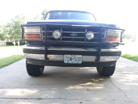 1994 Ford Bronco - Front view of a 1994 Ford Bronco equipped with a bull bar and auxiliary lights.