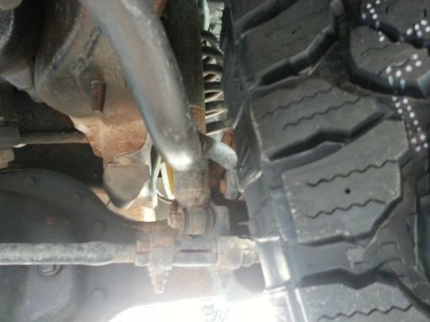 1994 Ford Bronco - Undercarriage view showing suspension parts and a tire.