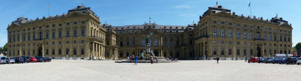 Würzburg Residence palace with cars parked in front courtyard