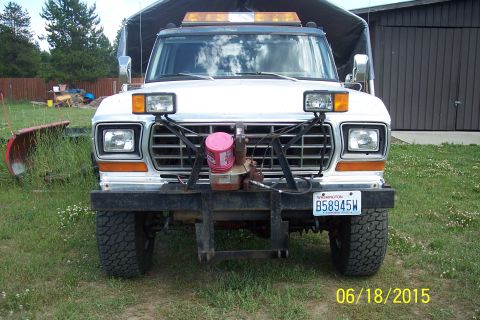 1973 Ford F-250 - This Ford F-Series truck is equipped with a snow plow mount and auxiliary lights.