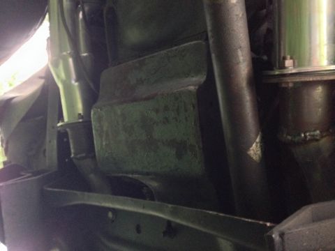 1979 Ford Bronco - Undercarriage view of a vehicle, focusing on frame and exhaust components.