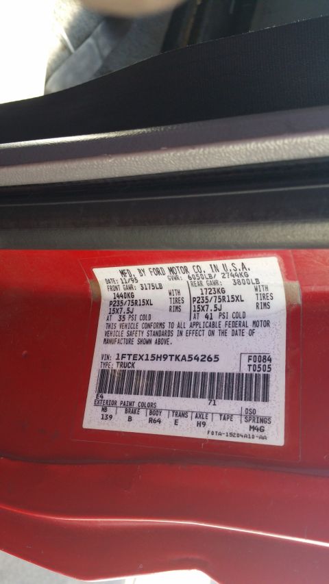 1995 Ford F-150 - VIN sticker on a vehicle door details manufacturing information and specifications.