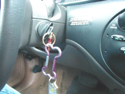 1997 Ford Taurus - Interior view of a 1997 Ford Taurus with keys in the ignition and a decorative keychain attached.