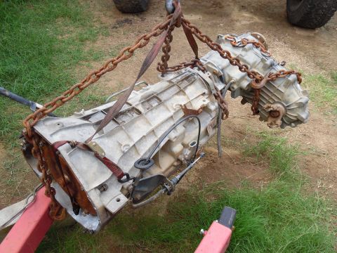 1993 Ford Bronco - The TC is strapped into the bellhousing so it doesn't slide out, and the lines are threaded back into their fittings to keep rain out.