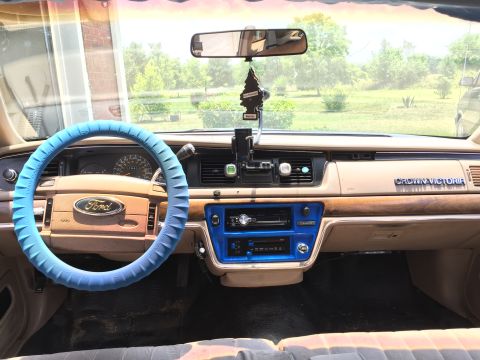 1994 Ford Crown Victoria - Interior view of a 1994 Ford Crown Victoria, showing the dashboard and steering wheel.