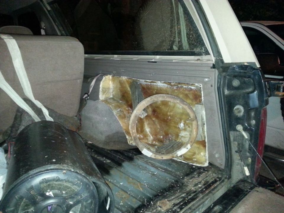 Custom speaker enclosure and subwoofer in vehicle cargo area