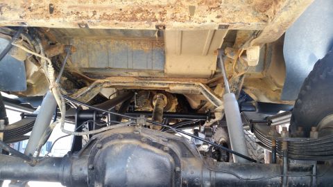 1988 Ford Bronco - Underside view shows the rear axle and suspension of a truck, with a SUPERMOTORS.NET watermark.