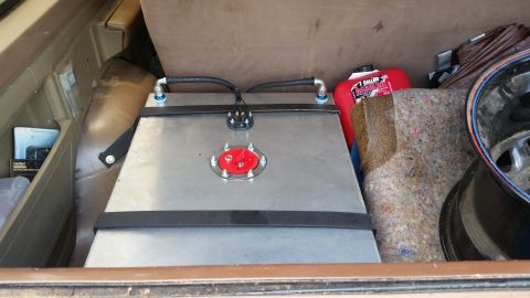 1988 Ford Bronco - Aftermarket fuel cell and red gas can are visible in the cargo area of a vehicle.