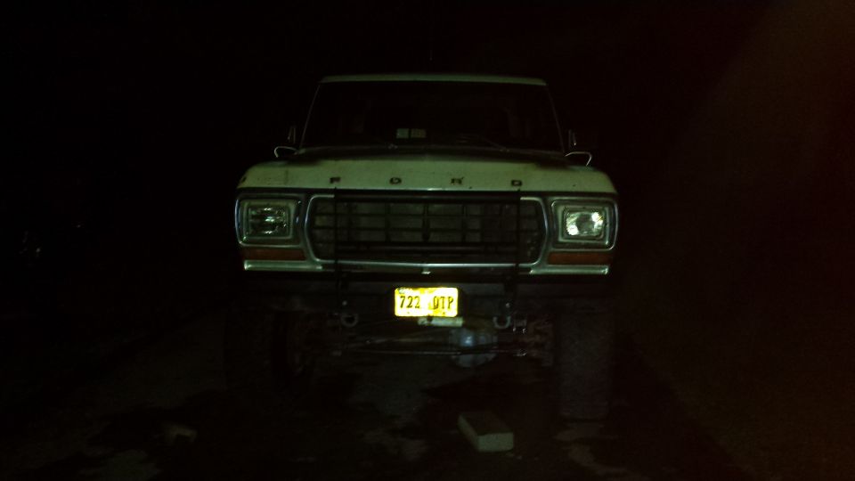 1979 Ford Bronco front view at night with license plate 722 UTP