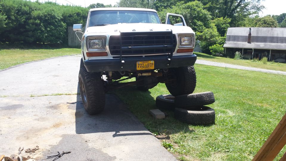 Lifted white 1979 Ford Bronco front view with black grille guard and Virginia license plate.