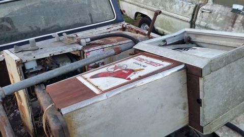 2015 Chevrolet new - A close-up view of an old, rusty Texaco Fire Chief gasoline pump with a red star logo and a red airplane graphic. The pump is situated outd…