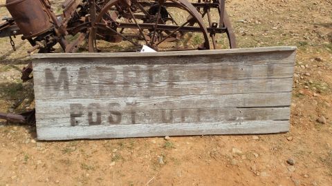 2015 Chevrolet new - A weathered wooden sign with faded lettering that reads "MARBLE POST OFFICE" is in the foreground, with a rusty, antique farm implement in…