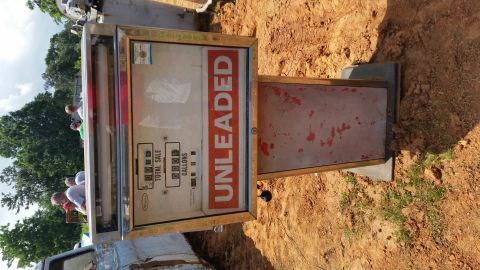 2015 Chevrolet new - An antique Wayne gas pump with "UNLEADED" printed in large orange letters is shown outdoors on dirt and grass. The pump has a glass display…