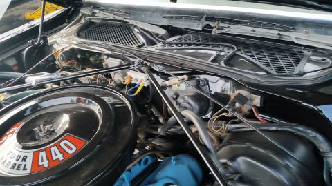 1991 Ford LTD Crown Victoria - Photograph of a Mopar 440 Four Barrel engine bay, not a technical document.