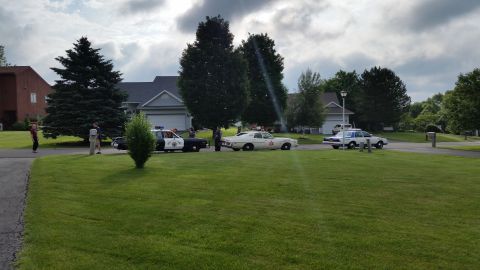 1991 Ford LTD Crown Victoria - Photograph of vintage police cars gathered outdoors, not a technical document.