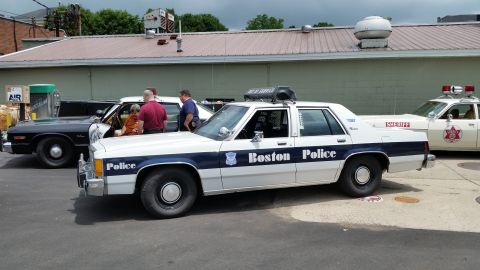 1991 Ford LTD Crown Victoria - Photograph of a Boston Police Crown Victoria with other vintage police cars, not a technical document.