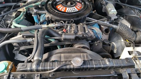 1991 Ford LTD Crown Victoria - Photograph of a Mopar 440 Four Barrel engine bay, not a technical document.