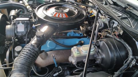 1991 Ford LTD Crown Victoria - Photograph of a 440 V8 engine with chrome air cleaner in an engine bay, not a technical document.