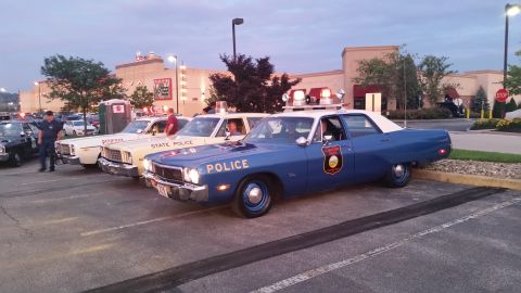 1991 Ford LTD Crown Victoria - Photo of vintage State Police patrol cars lined up at a meet, not a technical document.