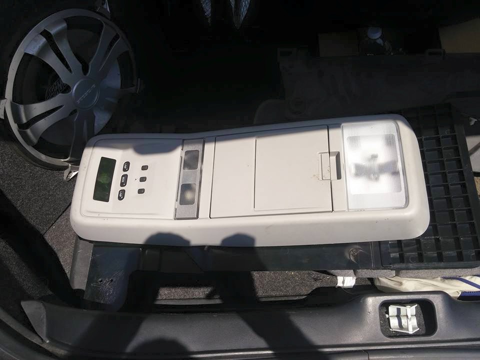 Removed overhead console with display and map lights on the ground
