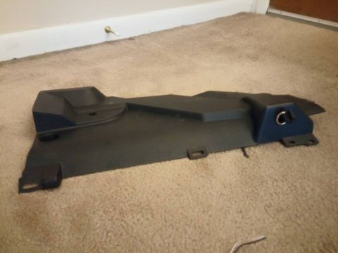2000 Mercury Grand Marquis - A black car floor mat lies on a tan carpeted floor.
