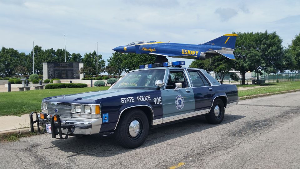Blue Massachusetts State Police Ford LTD Crown Victoria with Blue Angels jet behind