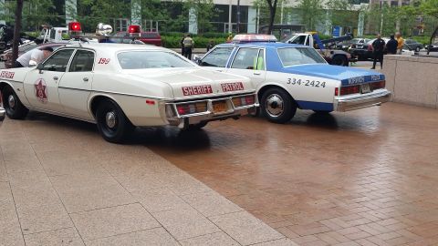 1991 Ford LTD Crown Victoria - Photograph of a Sheriff Patrol car and a Toronto Police car at a car show, not a technical document.