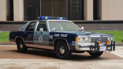 1991 Ford LTD Crown Victoria - Photograph of a Massachusetts State Police Ford cruiser, not a technical document.