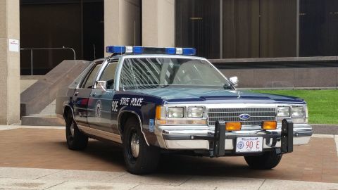 1991 Ford LTD Crown Victoria - Photograph of a Massachusetts State Police Ford cruiser, not a technical document.