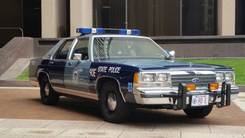 1991 Ford LTD Crown Victoria - Photograph of a Massachusetts State Police Ford cruiser, not a technical document.