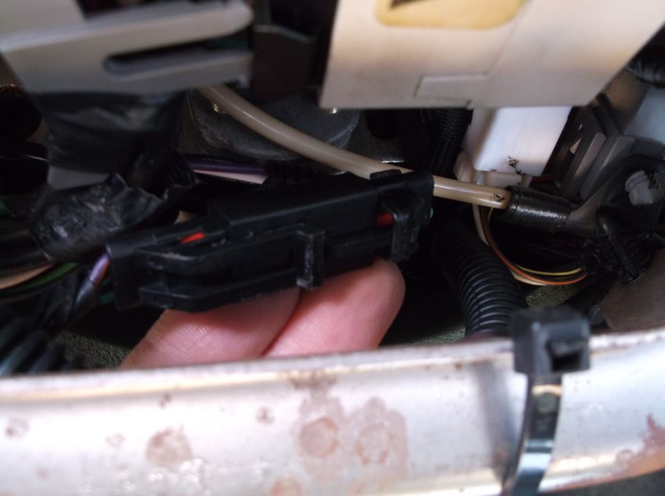 Black electrical connector with wires and tube