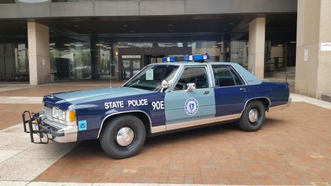1991 Ford LTD Crown Victoria - Photograph of a Massachusetts State Police Ford cruiser, not a technical document.