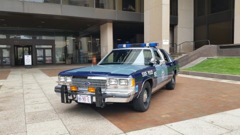 1991 Ford LTD Crown Victoria - Photo of a Massachusetts State Police Ford Crown Victoria cruiser parked outside a building.