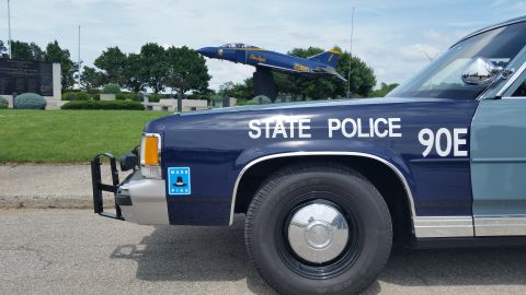 1991 Ford LTD Crown Victoria - Photo detail of a Massachusetts State Police Ford Crown Victoria front fender lettered State Police 90E.
