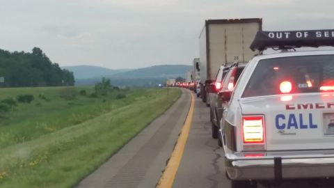 1991 Ford LTD Crown Victoria - Photo of stopped highway traffic seen from behind an emergency response station wagon.