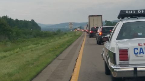 1991 Ford LTD Crown Victoria - Photograph of congested highway traffic taken from beside an emergency vehicle's rear fender.